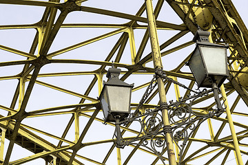 Image showing Decorative lamps hanging from bridge