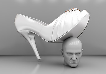 Image showing Man\'s head under a female heel 