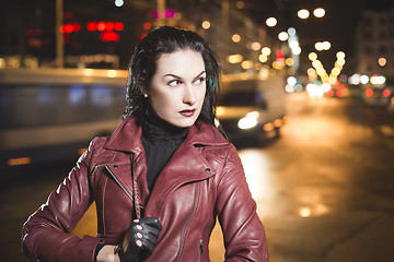 Image showing Business woman on a city traffic bokeh background