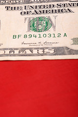 Image showing american dollars on american flag