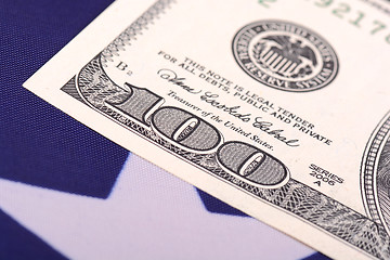 Image showing american dollars on american flag