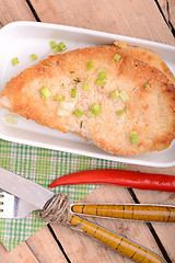 Image showing Fresh meat on white plate with red pepper