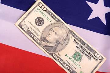 Image showing american dollars on american flag