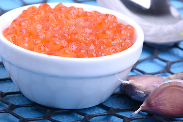 Image showing close up red caviar with garlic