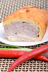 Image showing Fresh meat on white plate with red pepper