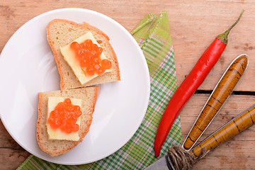 Image showing sandwich with red caviar on white plate