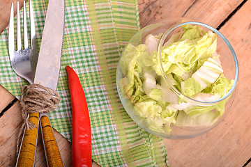 Image showing Cabbage chopped in glass bowl with red pepper