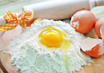 Image showing flour and raw eggs