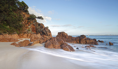 Image showing Morning light glistens on the volcanic rocks at Shoal Bay