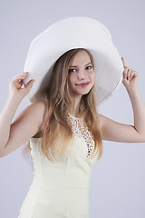 Image showing Young lady in white hat