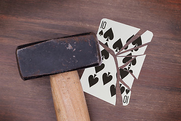 Image showing Hammer with a broken card, ten of spades