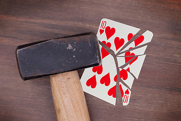 Image showing Hammer with a broken card, ten of hearts