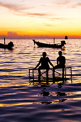 Image showing sunrise people boat  and water in thailand  coastline south chin