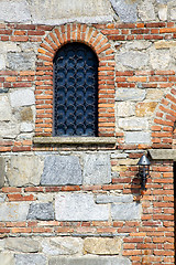 Image showing besnate cross  rose window   and mosaic wall  