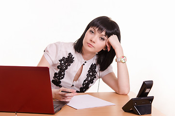 Image showing Tired call-center employee leaned her head on 