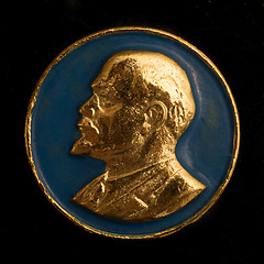 Image showing Soviet badge Lenin golden relief on a blue background