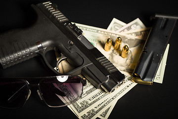 Image showing gun with bullet on US dollar banknotes