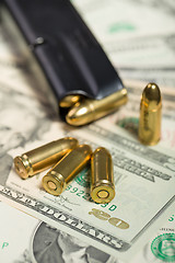 Image showing bullet on US dollar banknotes