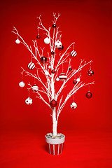 Image showing Christmas Tree decorated in red and white baubles.