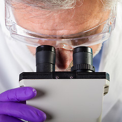 Image showing Life science researcher microscoping.