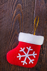 Image showing red sock on wooden board