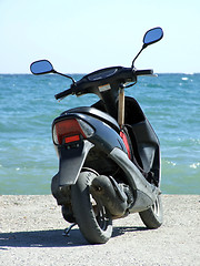 Image showing motorbike on a mooring on a background of the blue sea