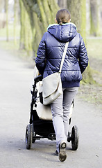 Image showing Young mother with  pram 