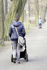 Image showing Young mother with  pram 