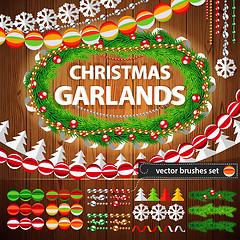 Image showing Christmas Garlands Set on Wood Background