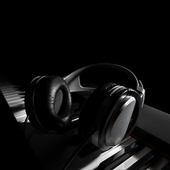 Image showing Piano keyboard with headphones