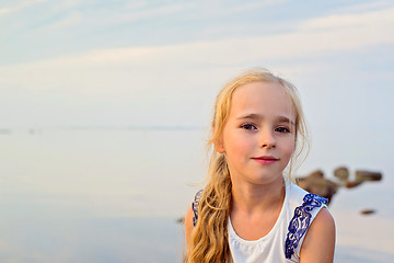 Image showing Portrait of little cute girl on sunset