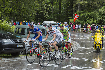 Image showing Group of Three Cyclists
