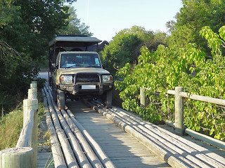 Image showing off-road vehicle on wooden bridge