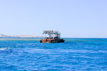 Image showing Old Rusty Barge floating on the Sea