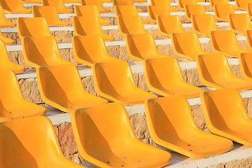 Image showing Stadium Yellow Chairs at sun light.