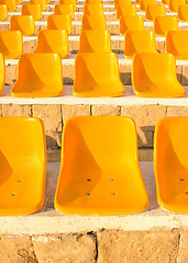 Image showing Stadium Yellow Chairs at sun light.