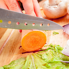 Image showing Woman\'s hands cutting vegetables