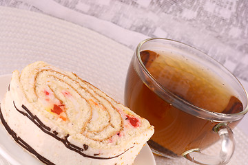 Image showing cup of tea and some cookies on white material background