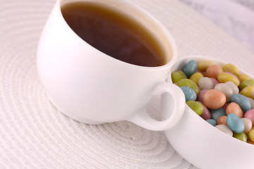 Image showing A cup of tea (coffee) and candies