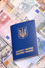 Image showing ukrainian passport with euro notes and american dollars