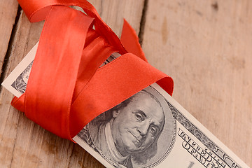 Image showing american money and red ribbon