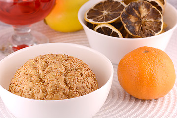 Image showing sweet cake on white plate, fruits and red wine