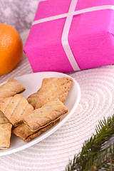 Image showing sweet cake on white plate and fruits and red gift box