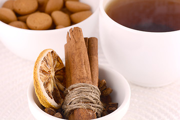 Image showing cup of tea (coffee), some cookies and old fruits