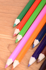 Image showing colored pencils  on wooden background