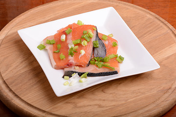 Image showing Slice of red fish salmon on white plate