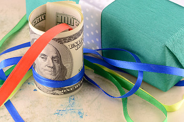 Image showing american money dollars and green gift box