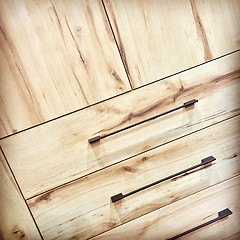 Image showing Wooden dresser with metal handles