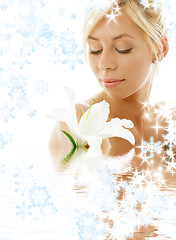Image showing lily blond in water with snowflakes