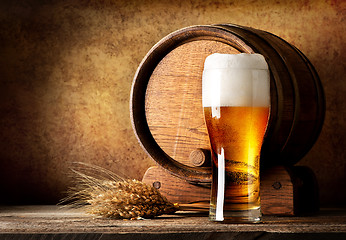 Image showing Wooden barrel and beer